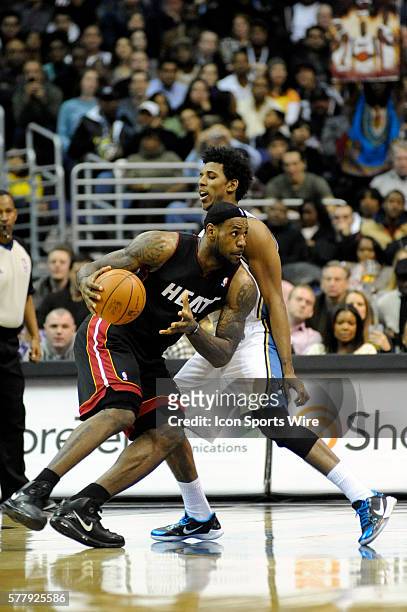 Miami Heat small forward LeBron James in action against Washington Wizards shooting guard Nick Young at the Verizon Center in Washington, D.C. Where...