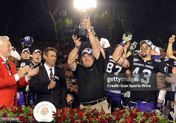 Head coach Gary Patterson holds the trophy in the air during the 97th Rose Bowl Game presented by VIZIO between the TCU Horned Frogs and the...