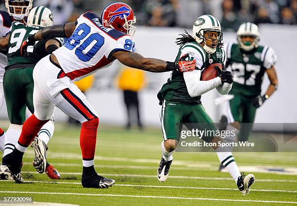 New York Jets cornerback Marquice Cole carries the ball after intercepting the pass intended for Buffalo Bills tight end David Martin during the...