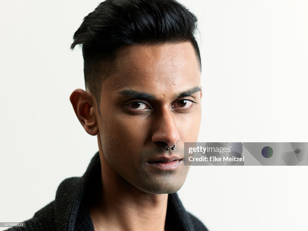 Androgynous young man with piercing