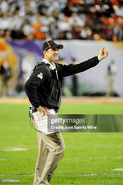 Stanford Cardinal Head Coach Jim Harbaugh gestures on the field during the 2nd half of the Discover Orange Bowl game between Stanford Cardinal and...