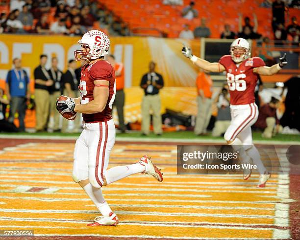 Stanford Cardinal Tight End Coby Fleener scores a touchdown as Stanford Cardinal Tight End Zach Ertz celebrates in the end zone during the 2nd half...
