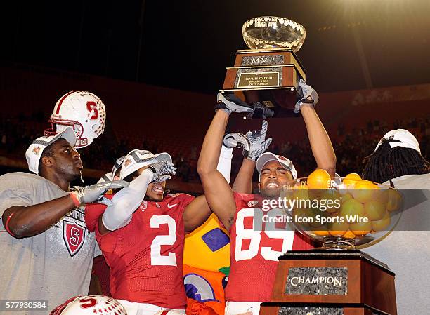 Stanford Cardinal Wide Receiver Doug Baldwin holds the mvp trophy and celebrates with Stanford Cardinal Cornerback Corey Gatewood after the end of...