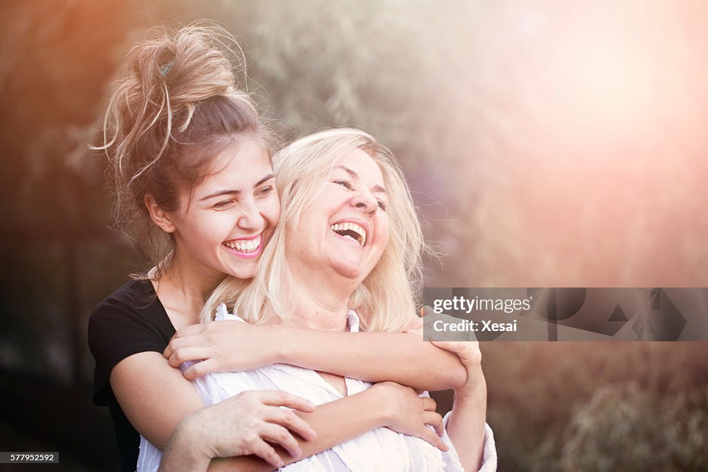 Smiling mother with young daughter