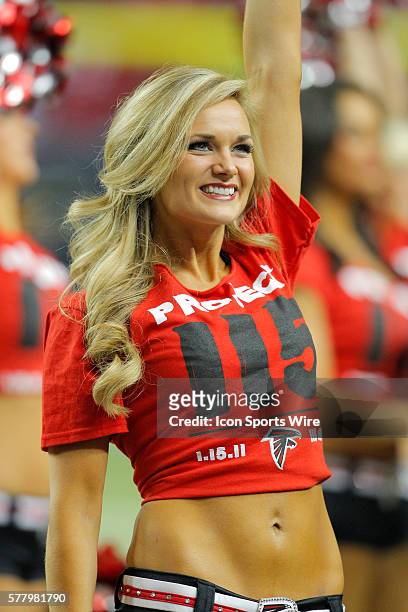 An Atlanta Falcons cheerleader performs in the Green Bay Packers 48-21 victory over the Atlanta Falcons in the NFC Divisional playoff at the Georgia...