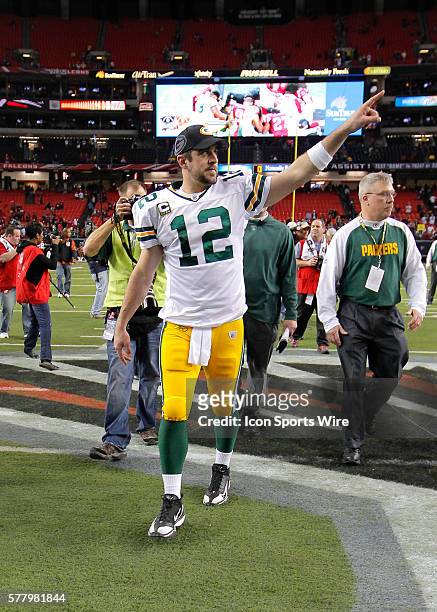 Green Bay Packers quarterback Aaron Rodgers celebrates the victory in the Green Bay Packers 48-21 victory over the Atlanta Falcons in the NFC...