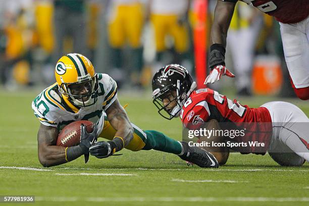 Green Bay Packers wide receiver Donald Driver is tackled by Atlanta Falcons safety Erik Coleman in the Green Bay Packers 48-21 victory over the...