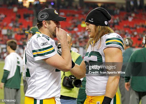 Green Bay Packers quarterback Aaron Rodgers and linebacker Clay Matthews share some laughs as the clock counts down in the Green Bay Packers 48-21...