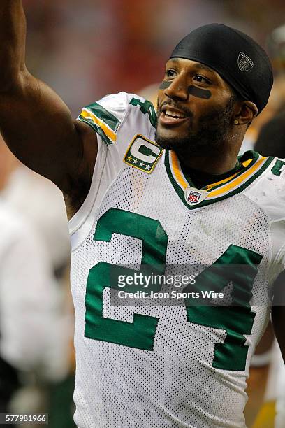 Green Bay Packers cornerback Jarrett Bush waves to fans as the final minutes tick away in the Green Bay Packers 48-21 victory over the Atlanta...