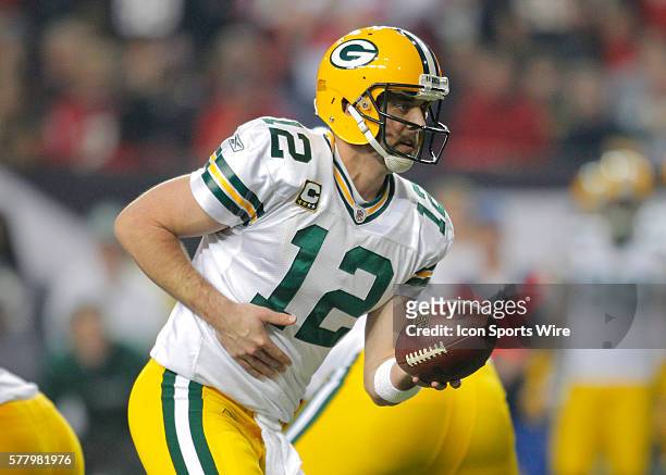 Green Bay Packers quarterback Aaron Rodgers looks to hand off in the Green Bay Packers 48-21 victory over the Atlanta Falcons in the NFC Divisional...