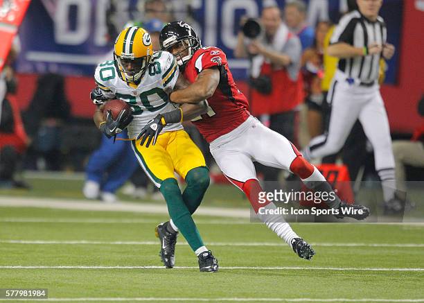 Green Bay Packers wide receiver Donald Driver is brought down by Atlanta Falcons cornerback Chris Owens in the Green Bay Packers 48-21 victory over...