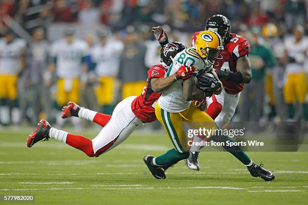 Green Bay Packers wide receiver Donald Driver is tackled by Atlanta Falcons safety Erik Coleman in the Green Bay Packers 48-21 victory over the...