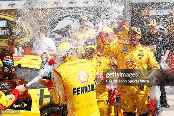 Sprint Cup Series driver Joey Logano celebrates in victory lane after winning the NASCAR Sprint Cup Series Duck Commander 500 at the Texas Motor...