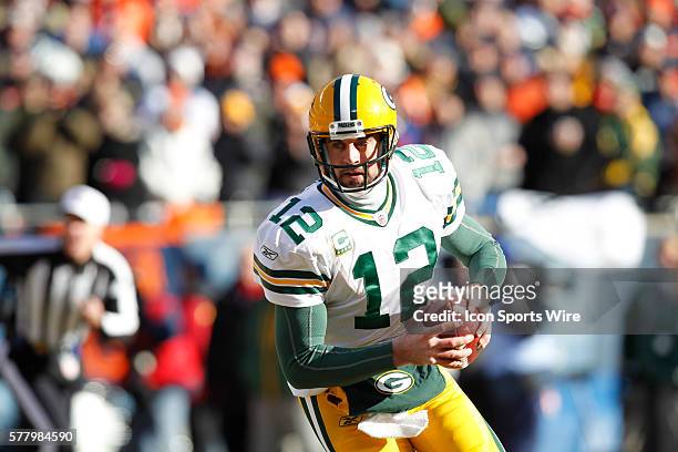 Aaron Rodgers looks for an open receiver.: The Green Bay Packers defeated the Chicago Bears 21-14 in the NFC Championship playoff game at Soldier...