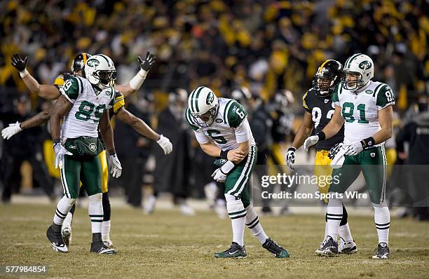 Jets vs Pittsburg Steelers AFC Championship game at Heinz Field Pittsburg Pa: Jets quarterback Mark Sanchez holds his arm after he is sacked allowing...