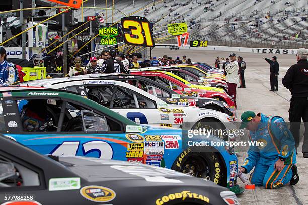 Cars lined up on the starting grid before the rain delayed 18th Annual Duck Commander 500 at Texas Motor Speedway in Ft. Worth, TX.