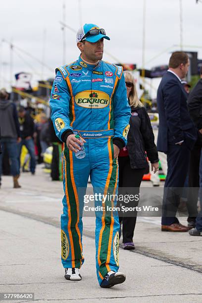 Aric Almirola, driver of the Eckrich Ford walks down pit road before the rain delayed 18th Annual Duck Commander 500 at Texas Motor Speedway in Ft....