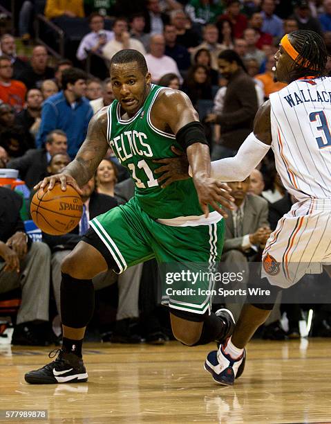 Boston Celtics power forward Glen Davis drives against Charlotte Bobcats small forward Gerald Wallace during an NBA basketball game at Time Warner...