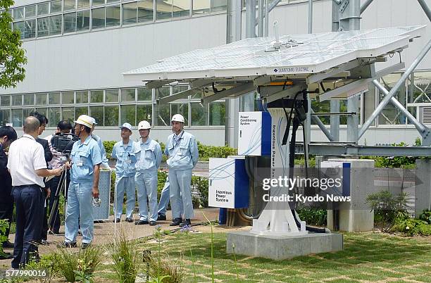 Japan - Photo shows Sumitomo Electric Industries Ltd.'s solar power equipment which will be used for its next-generation power grid system, called...