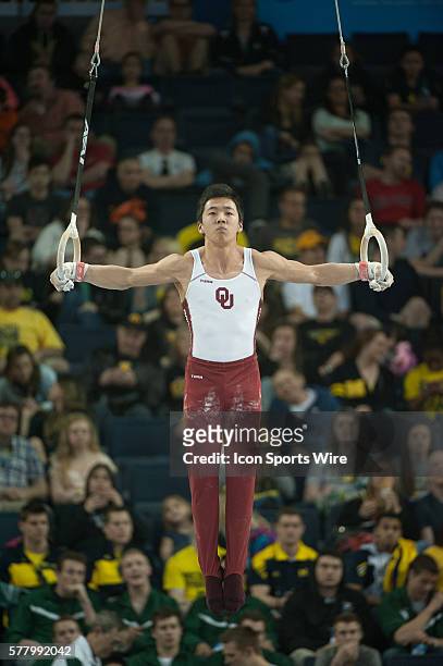 April 11, 2014 - Ann Arbor, MI: Kanji Oyama of Oklahoma competes on the still rings during the Team and All-Around Finals of the NCAA Men's...