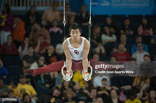 April 11, 2014 - Ann Arbor, MI: Kanji Oyama of Oklahoma competes on the still rings during the Team and All-Around Finals of the NCAA Men's...