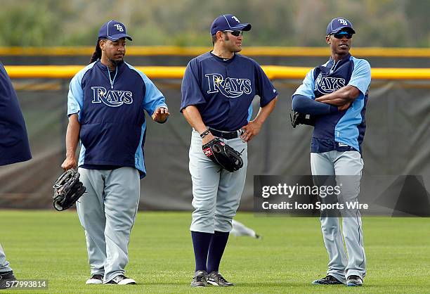 Manny Ramirez, Johnny Damon and B. J. Upton gather together in the outfield during the Rays spring training work out at the Charlotte Sports Park in...