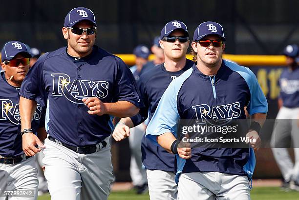 Johnny Damon and Evan Longoria stretch during the Rays spring training work out at the Charlotte Sports Park in Port Charlotte, Florida.