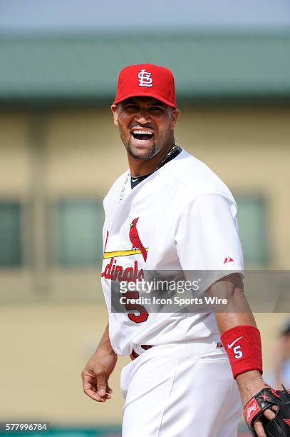 St. Louis Cardinals Infielder Albert Pujols laughs during an MLB spring training game in which the St. Louis Cardinals defeated the New York Mets 3-2...