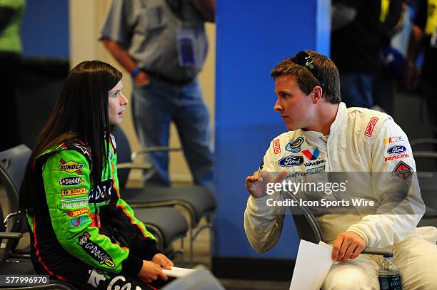Danica Patrick Go Daddy Chevrolet Imapla SS and Trevor Bayne Roush Racing Ford Mustang have a conversation during the Sam's Town 300 driver's meeting...