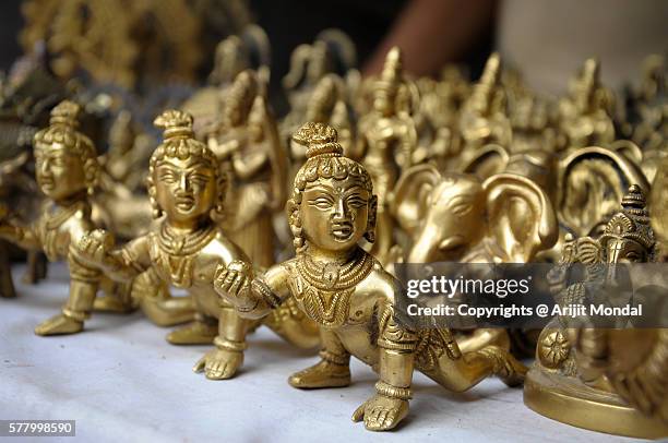 bal gopal idols in brass metal for sell also called little krishna - sri krishna stock pictures, royalty-free photos & images