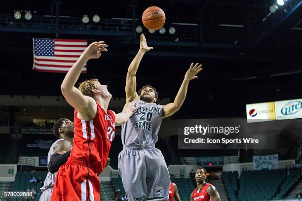 Cleveland State Vikings G Kaza Keane shoots over Youngstown State Penguins F Bobby Hain during the game between the Youngstown State Penguins and...