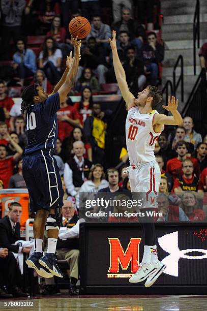 Penn State Nittany Lions forward Brandon Taylor makes a 3-point basket against Maryland Terrapins guard/forward Jake Layman at the Xfinity Center in...