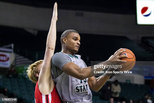 Cleveland State Vikings F Anton Grady is defended by Youngstown State Penguins F Bobby Hain during the game between the Youngstown State Penguins and...