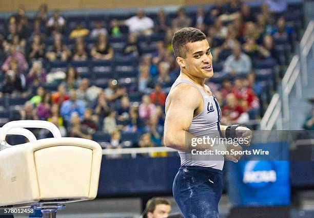 California's Donothan Bailey reacts after competing on the pommel horse during individual event finals at the 2014 national collegiate men's...