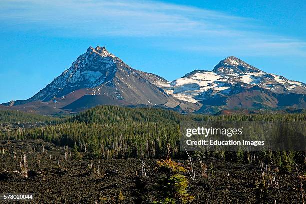 North Sister and Middle Sister volcanic peaks in the Three Sisters Wilderness of the central Cascade Mountains of Oregon seen in late summer from a...