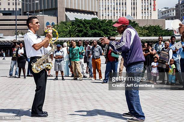 South Africa, Cape Town, City Centre, Adderley Street, Navy Band musicians playing free concert downtown skyline.