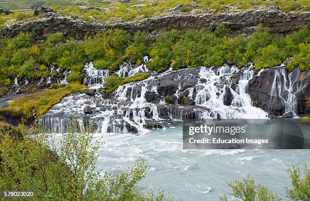 Iceland Hraunfossar Lava Falls in Reykholt Valley in West Iceland many falls along cliff from glacier Langjokull.