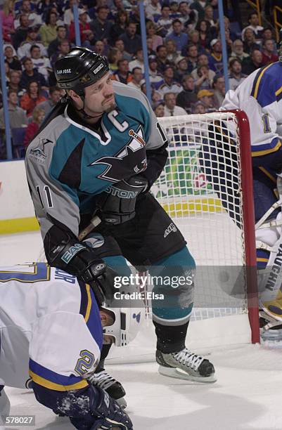 Owen Nolan of the San Jose Sharks defends over Bryce Salvador of the St. Louis Blues during game 1 of the western conference playoffs at the Savvis...