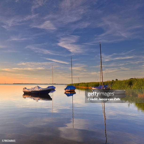 docked ships at sunset - jenco van zalk stock pictures, royalty-free photos & images