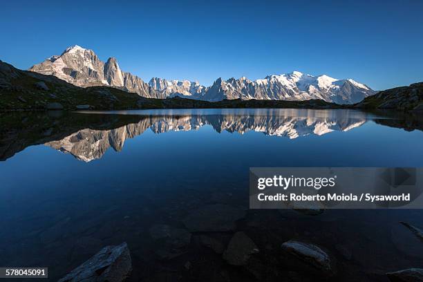 mont blanc and lake cheserys france - lake chesery stockfoto's en -beelden