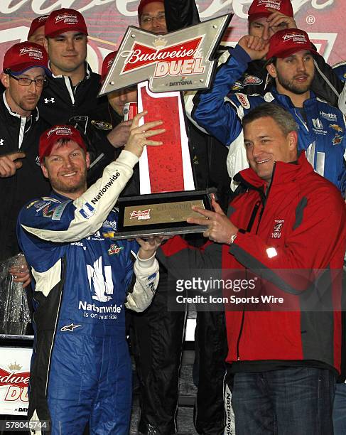 Dale Earnhardt Jr. Celebrates winning the NASCAR Sprint Cup Series Budweiser Duel at Daytona International Speedway in Daytona, Florida