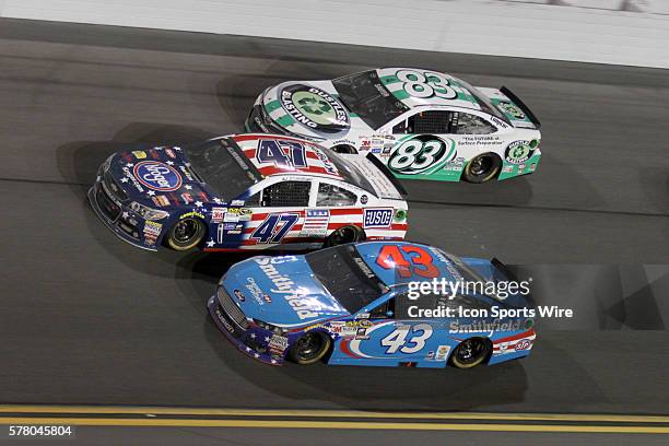 Johnny Sauter, A.J. Allmendinger, and Aric Almirola go three wide during the running of the NASCAR Sprint Cup Series Budweiser Duel race at Daytona...