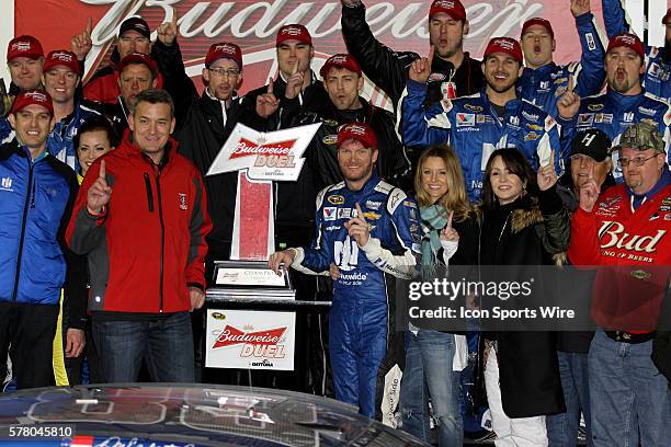 Dale Earnhardt Jr. Celebrates winning the NASCAR Sprint Cup Series Budweiser Duel race at Daytona International Speedway in Daytona, Florida