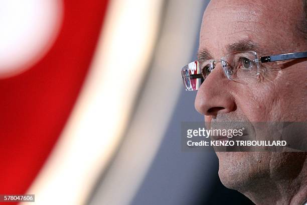 France's opposition Socialist Party candidate for the 2012 French presidential election Francois Hollande takes part in the TV show "Le petit...