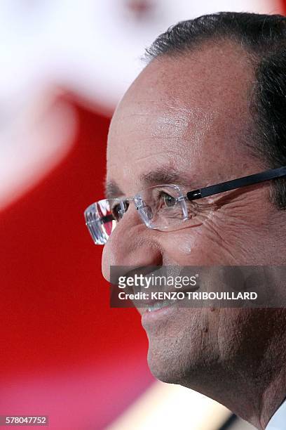 France's opposition Socialist Party candidate for the 2012 French presidential election Francois Hollande takes part in the TV show "Le petit...