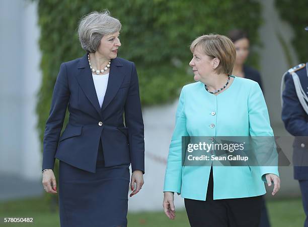 German Chancellor Angela Merkel chats with British Prime Minister Theresa May upon May's arrival at the Chancellery on July 20, 2016 in Berlin,...