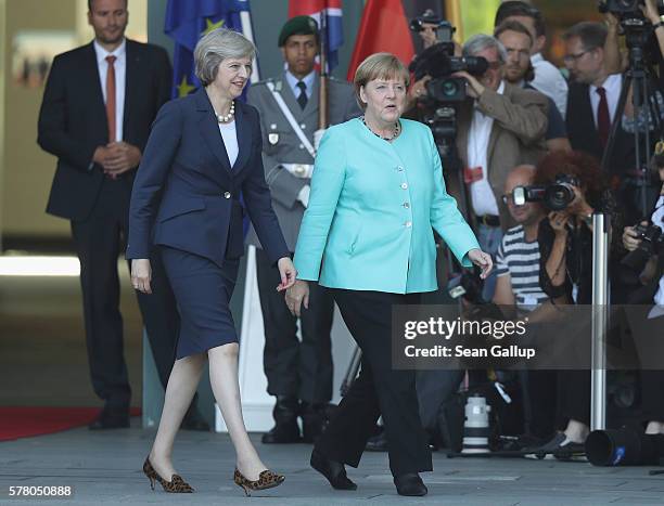 German Chancellor Angela Merkel chats with British Prime Minister Theresa May upon May's arrival at the Chancellery on July 20, 2016 in Berlin,...