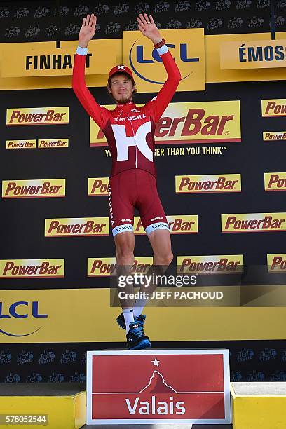 Stage winner Russia's Ilnur Zakarin celebrates on the podium after winning the 184,5 km seventeenth stage of the 103rd edition of the Tour de France...