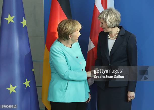 German Chancellor Angela Merkel and British Prime Minister Theresa May depart after speaking to the media following talks at the Chancellery on July...