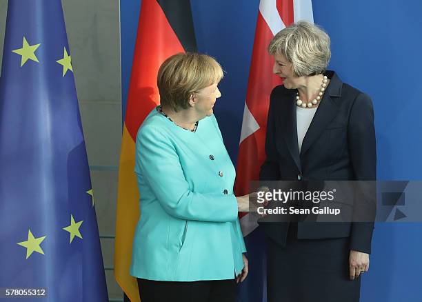 German Chancellor Angela Merkel and British Prime Minister Theresa May depart after speaking to the media following talks at the Chancellery on July...